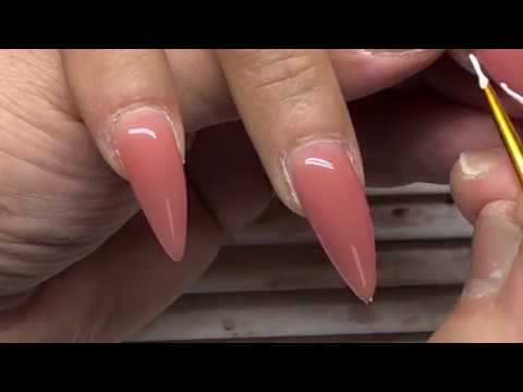 Stiletto nails beauty tutorial of gel nail extensions and french nail art designs
